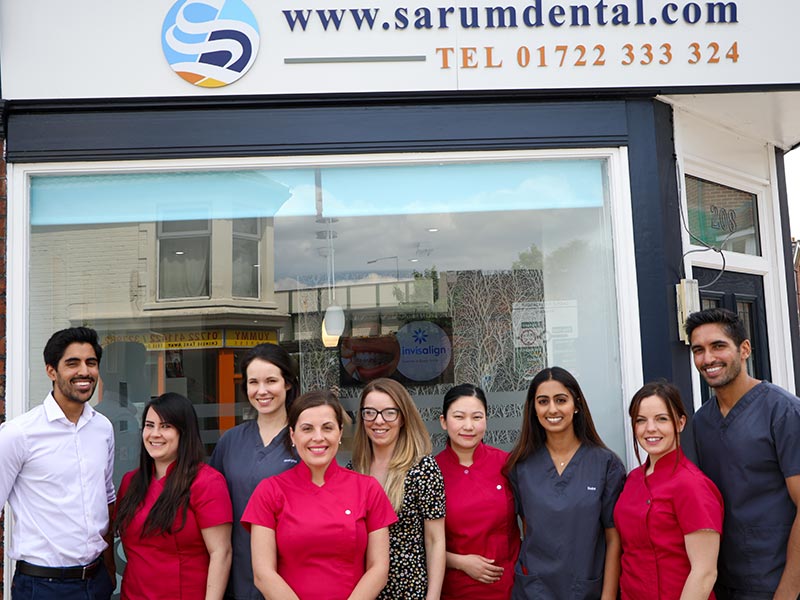 Sarum Dental Practice staff standing outside practice building