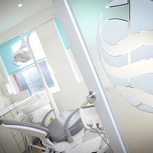 Sarum Dental Practice treatment room with grey dental chair and logo etched onto glass door